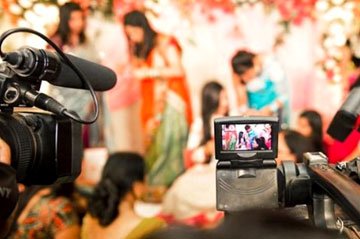 Cinematic wedding video production with professional lighting and camera setup
