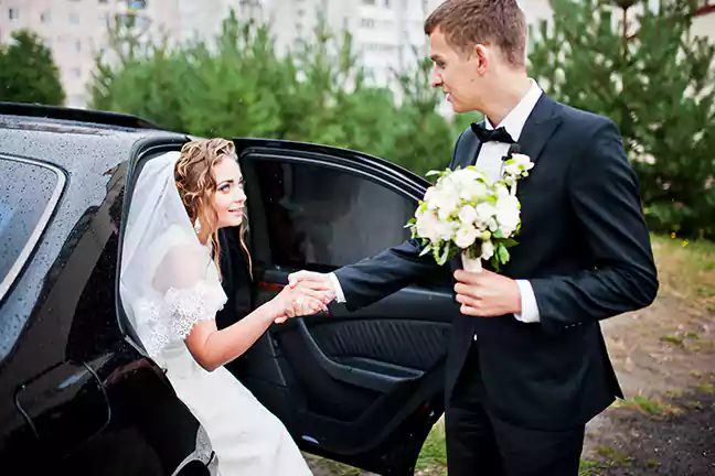 Luxury wedding car decorated with flowers for the bride and groom